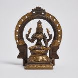 A Parcel-Gilt Bronze Seated Figure of a Female Deity, South India, 南印度 鎏金銅女神坐像, height 6.1 in — 15.6