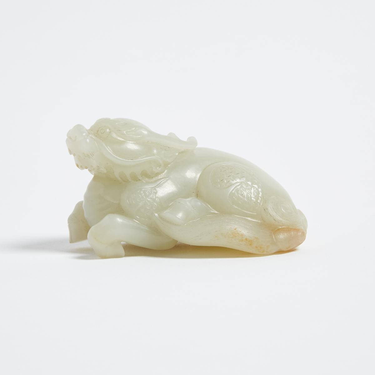 A White and Russet Jade Carved Qilin, 白玉臥麒麟, length 3.5 in — 8.9 cm - Image 2 of 3