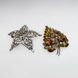 Two Sherman Japanned-Back Metal Brooches, 1 set with clear rhinestones and 1 set with autumn coloure