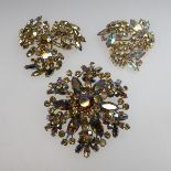 Three Sherman Gold Tone Metal Brooches, all set with aurora borealis rhinestones; 2.2", 2.0", 1.5"