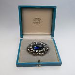 Georg Jensen Danish Sterling Silver Brooch, bezel set with an oval synthetic sapphire cabochon and 1