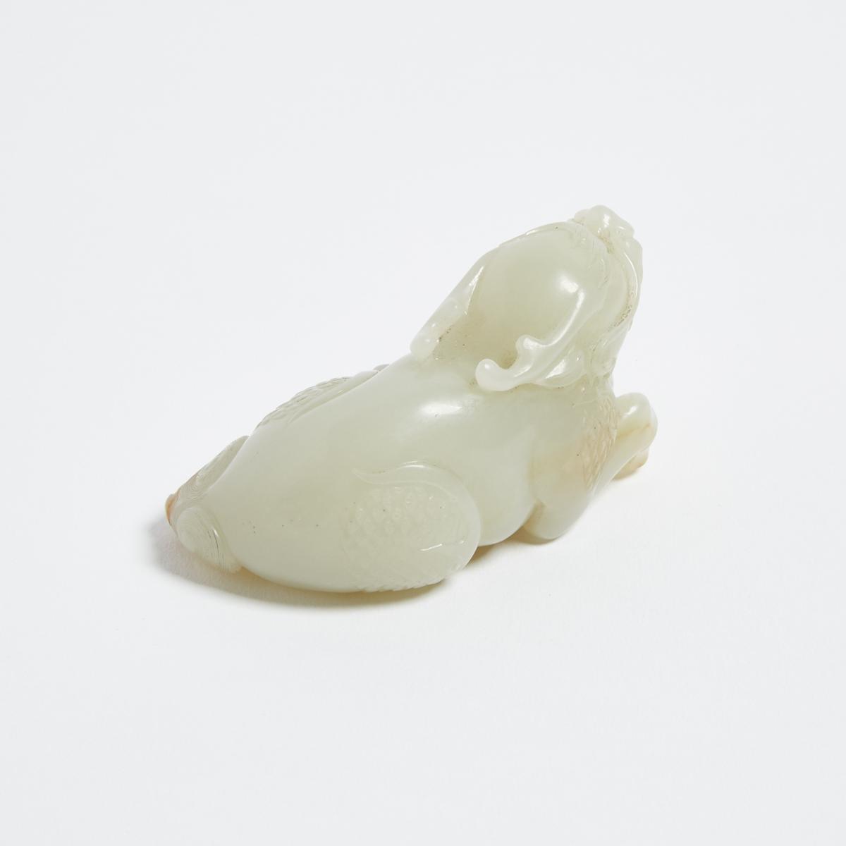 A White and Russet Jade Carved Qilin, 白玉臥麒麟, length 3.5 in — 8.9 cm - Image 3 of 3