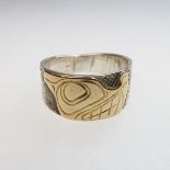 Lloyd Wadhams Jr. Kwakwaka'wakw Nation Sterling Silver Ring With Gold Overlay, engraved depicting a