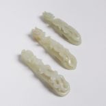 A Group of Three Celadon White Jade Chilong Belt Hooks, 青白玉蒼龍教子帶鉤一組三件, largest length 4.3 in — 10.8