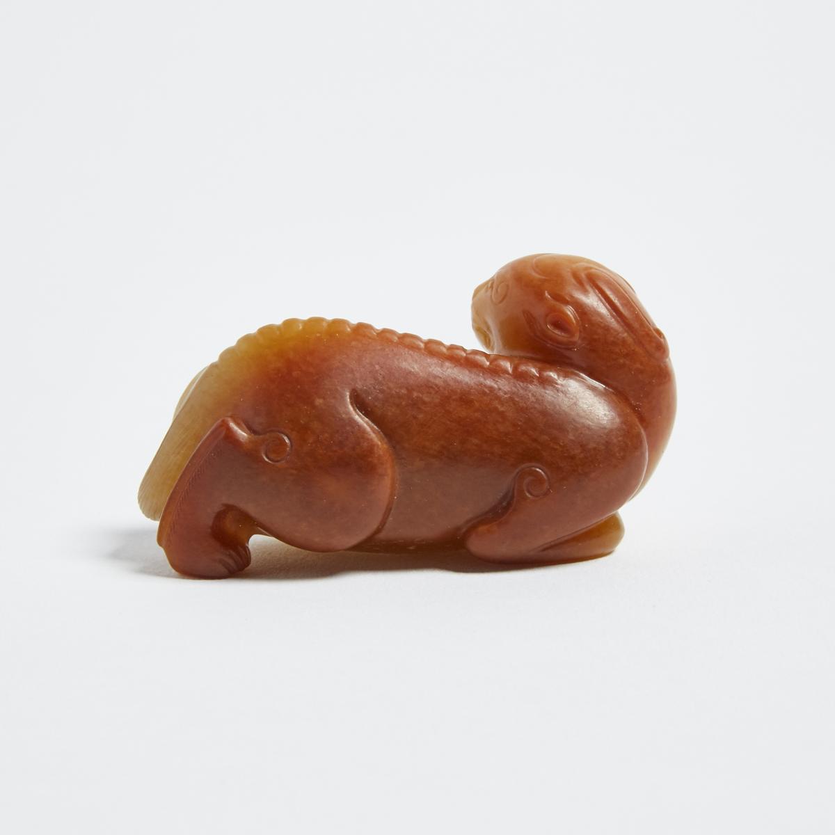 A Pale Celadon and Russet Jade Carving of a Lion, 青白玉帶皮臥獅, length 2.5 in — 6.3 cm - Image 3 of 3