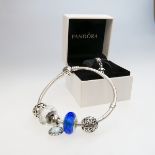 Pandora Sterling Silver Bracelet, with 5 charms together with another silver charm in the original b