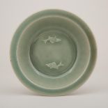 A Longquan Celadon 'Twin-Fish' Dish, 龍泉窯青釉雙魚紋折沿洗, diameter 7.9 in — 20 cm