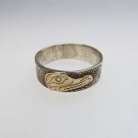 Lloyd Wadhams Jr. Kwakwaka'wakw Nation Sterling Silver Ring With Gold Overlay, engraved depicting a