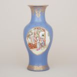 A Blue Ground Famille Rose Vase, Mid-20th Century, 二十世紀中期 藍地描金開窗粉彩人物紋魚尾瓶, height 17.5 in — 44.5 cm