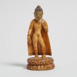 A Gilt Painted Ivory Figure of Shakyamuni, 牙雕鎏金彩繪釋迦牟尼立像, height 5.5 in — 14 cm