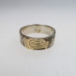 Lloyd Wadhams Jr. Kwakwaka'wakw Nation Sterling Silver Ring With Gold Overlay, engraved depicting an