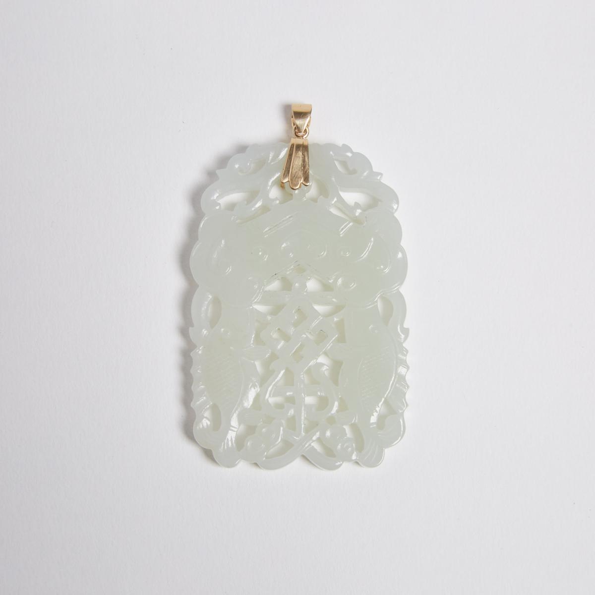 A White Jade Reticulated 'Double-Fish' Plaque, 白玉透雕'吉慶有餘'珮, length 2.5 in — 6.3 cm