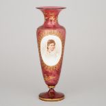 Bohemian Overlaid, Enameled and Gilt Red Glass Portrait Vase, late 19th century, height 11 in — 27.9