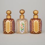 Three Bohemian Overlaid, Enameled and Gilt Glass Perfume Bottles, late 19th century, height 4.5 in —