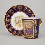 'Sèvres' 'Jeweled' Blue Ground Cup and a Saucer, late 19th/early 20th century, height 3.4 in — 8.7 c