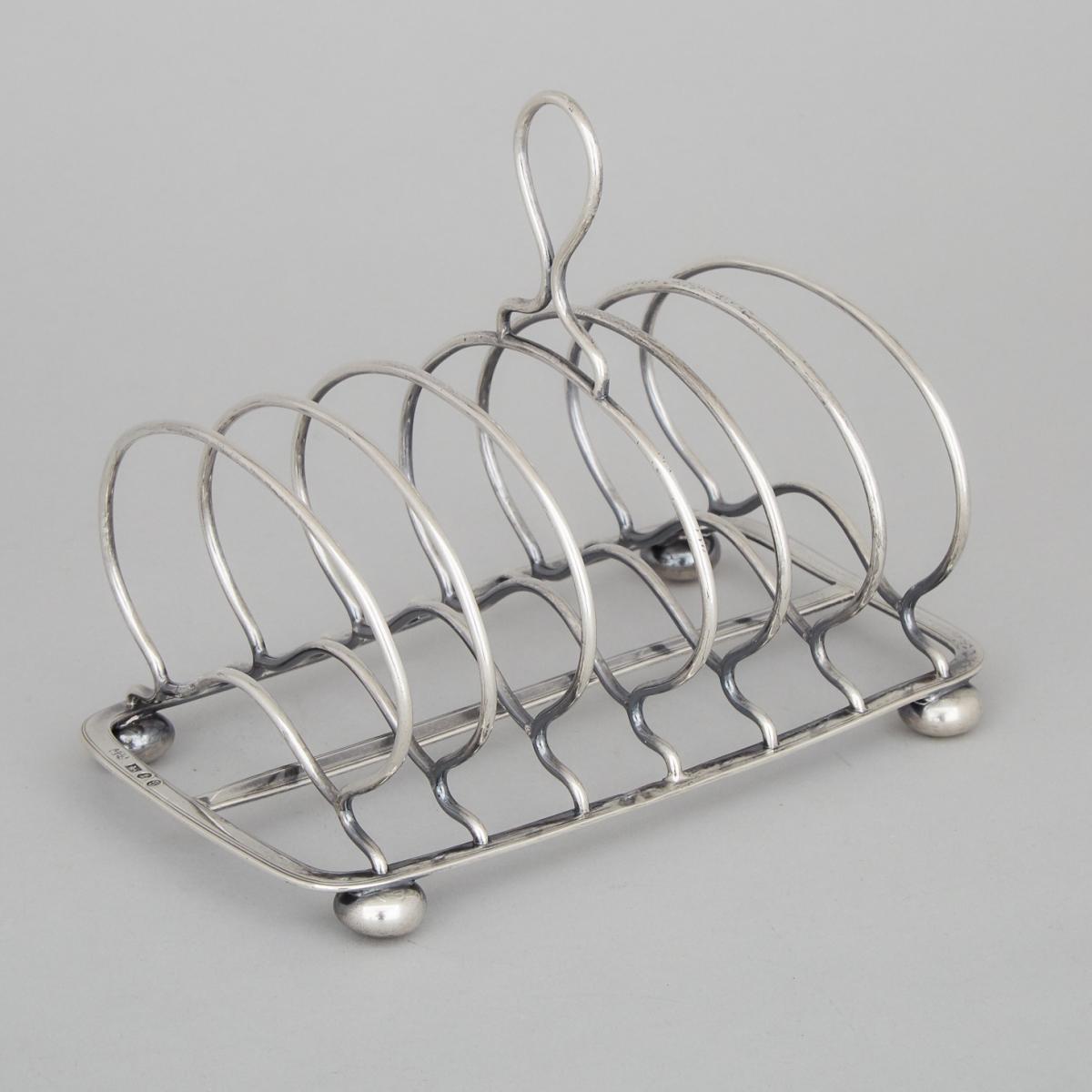 George III Silver Toast Rack, Thomas Blagden & Co., Sheffield, 1819, length 6.5 in — 16.5 cm