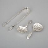 George III Irish Silver Sugar Tongs, John Shiels, Dublin, c.1790 and Two Georgian Caddy Spoons, Rich