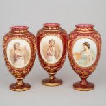 Bohemian Overlaid, Enameled and Gilt Red Glass Garniture of Three Portrait Vases, late 19th century,
