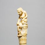 Carved Bone Cane with Water Bearer Nude Figural Handle, 19th/early 20th century, length 36 in — 91.4