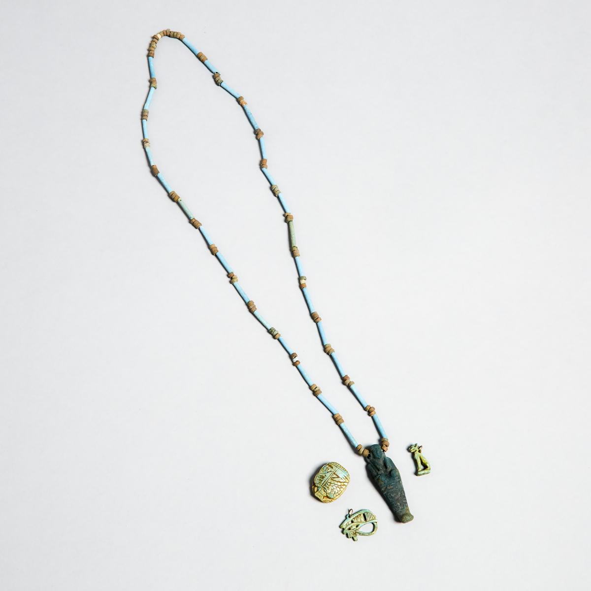 Group of Egyptian Turquoise Faience Amulets and Beads, New Kingdom to Late Period, 1550-332 B.C., sh