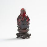 A Dark Olive-Green Overlay Ruby-Red Glass Snuff Bottle, 19th Century, 十九世紀 寶石紅地套墨綠料鼻煙壺帶座, height 2.7