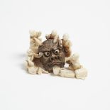 An Ivory Carved Oni Mask Group Okimono, Meiji Period, 日本 明治時期 牙雕人物鬼面具根付, 1.5 x 3.4 x 1.8 in — 3.9 x