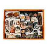 A small cabinet of mineral specimens. Including; smoky quartz, blue john flourspar, agate,