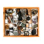 A wooden museum storage box containing mineral specimens. Including; uvite, ruby, hessonite,