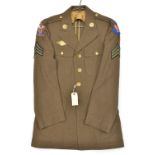 A WWII US Sergeants khaki tunic of the 4th Air Force, embroidered 4th AF shield to right shoulder