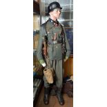 A museum quality composite Third Reich SS uniform on a dummy, including a tunic with collar patches,