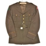 A WWII US army khaki tunic of the 91st Division, embroidered pine tree to right shoulder, Army