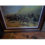 A coloured print “The Charge of the 21st Lancers at the Battle of Omdurman”after original by G D