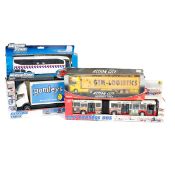 A quantity of larger scale basic plastic and metal commercial/PSV vehicles (toys). Majorette, Siku