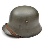 A German M16 steel helmet, the skull with dull grey/green finish, with original padded leather