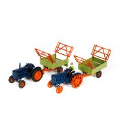 A Britains Ltd Fordson Major Tractor with driver (127F). In dark blue with orange 'spud' wheels.