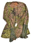 A WWII German style camouflage smock, with 2 pockets, elasticated waist and lace up front. GC