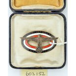 A Third Reich enamelled pin back badge, for the Military Administration Service of Belgium and