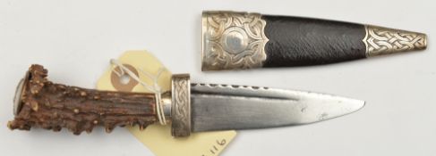 A skean dhu, SE blade 3½” (repointed) with short scalloped back edge and fuller, staghorn grip,