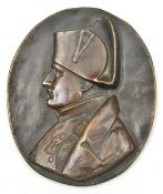 A bronze oval plaque of Napoleon, by David d’Angers, showing the Emperor head and shoulders,