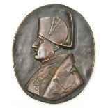 A bronze oval plaque of Napoleon, by David d’Angers, showing the Emperor head and shoulders,