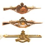 3 9ct gold sweetheart tie pins: RA badge on plain pin, RA badge on rifle and bayonet pin, Geo V RE