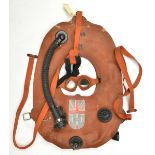 A WWII inflatable life jacket, with fastening straps, attachments, inflation tube and “Auxiliary