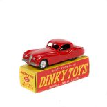 Dinky Toys Jaguar XK120 Coupe (157). A late example in bright red with spun wheels and treaded black