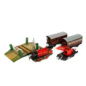 A quantity of Hornby O gauge tinplate railway. Including; a clockwork LMS 0-4-0 tender locomotive,