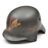 A Third Reich period fantasy M35 steel helmet, modified post war with cut outs for earphones,