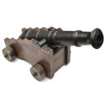 A cannon in the style of the 19th century, iron barrel (not bored through) 36”, stepped wooden