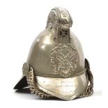 A fire officer’s presentation WM Merryweather pattern helmet, with front peak and large back peak,