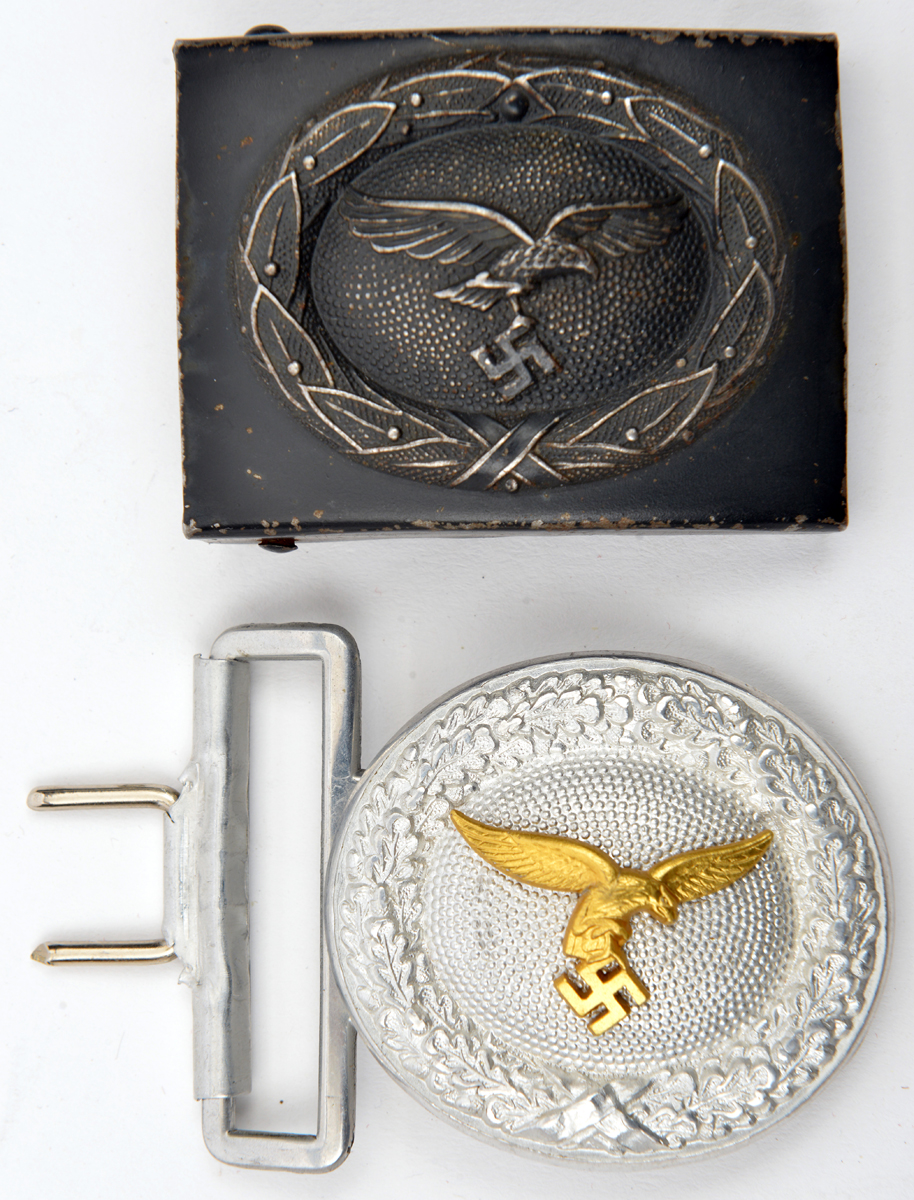 A Third Reich Luftwaffe officer’s oval aluminium belt buckle, with gilt eagle, the back with maker’s