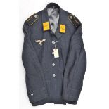 A Third Reich style blue/grey Luftwaffe 2 pocket jacket, with breast eagle and collar patches and