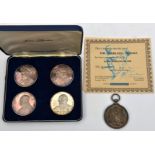 A set of 4 sterling silver medallions, commemorating Sir Winston Churchill, issued by John Pinches